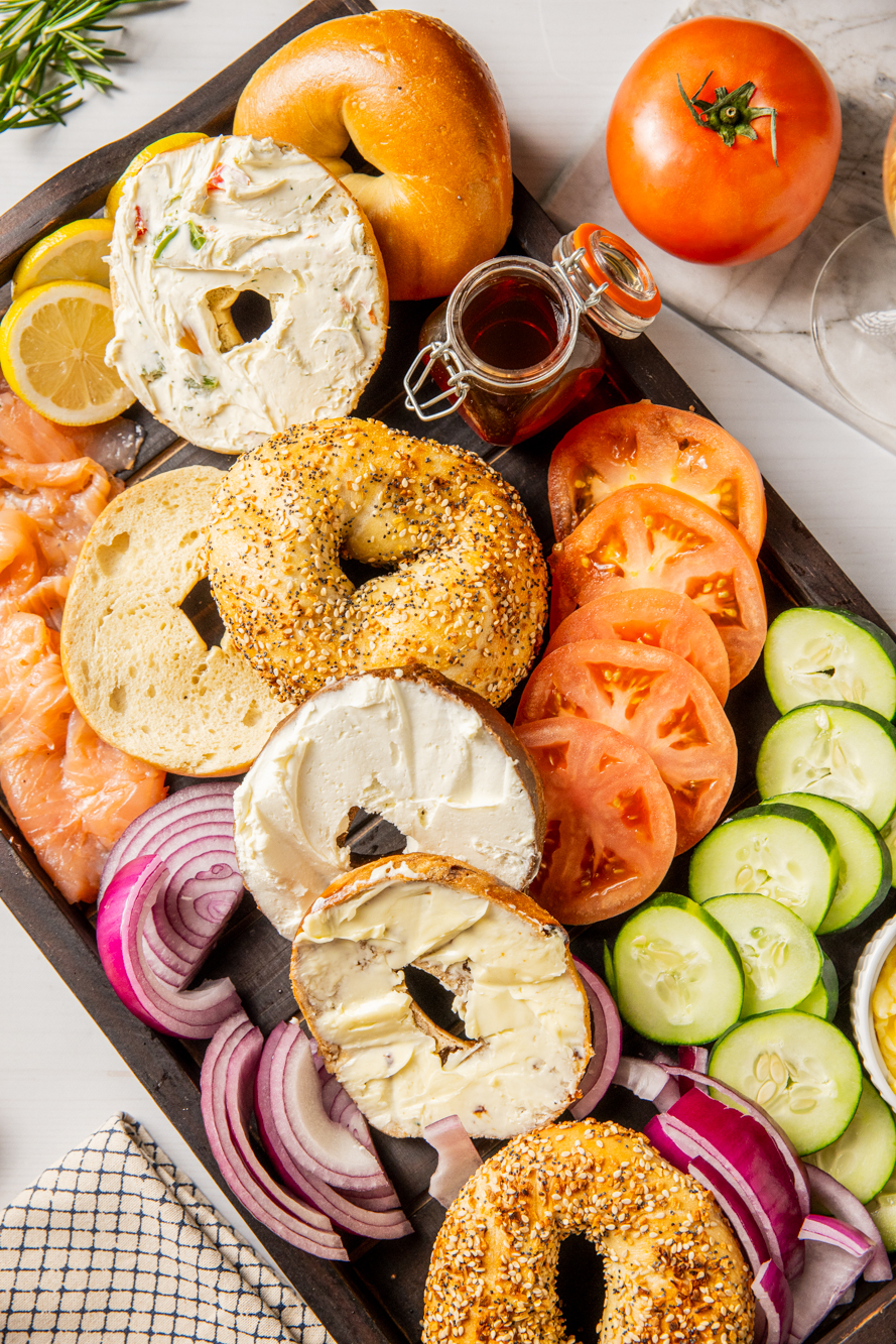 An array of bagels and toppings